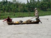 Fischer auf dem Nebenarm des Mekong